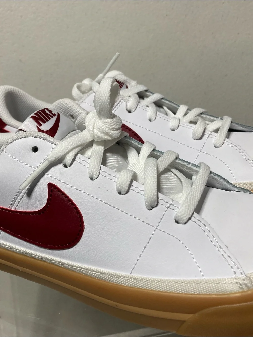 Nike Kids White Sneakers with Red Swoosh and Gum Sole